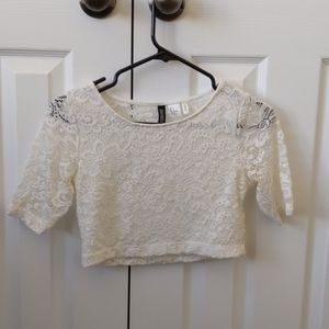 A white lacy croptop
